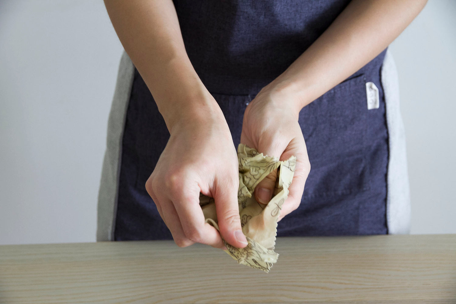 scrunch beeswax wrap to activate its "stickiness"